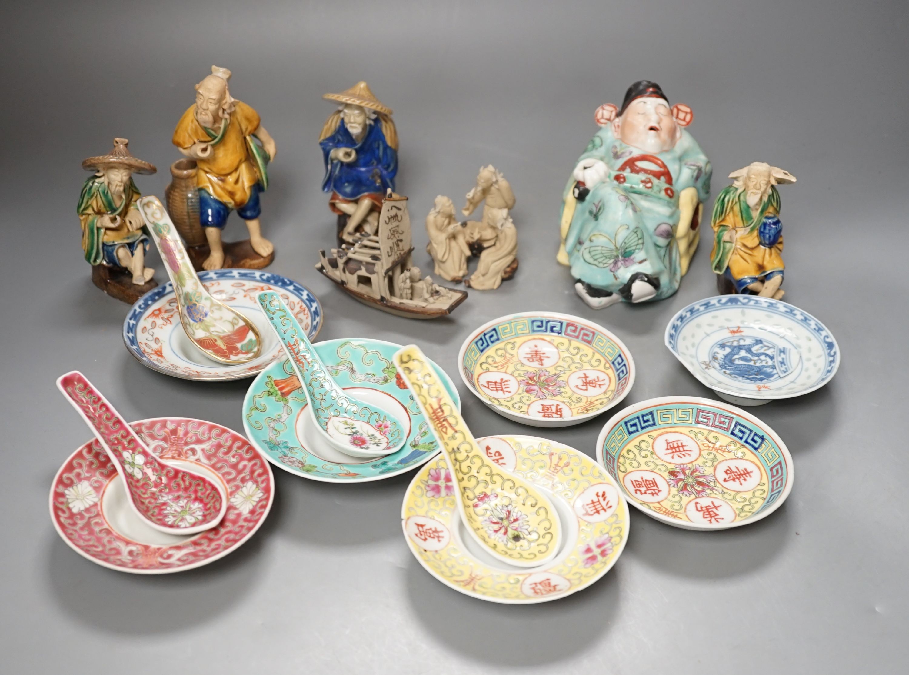Five Chinese ceramic figures, saucers, etc., tallest 15cm. (18)